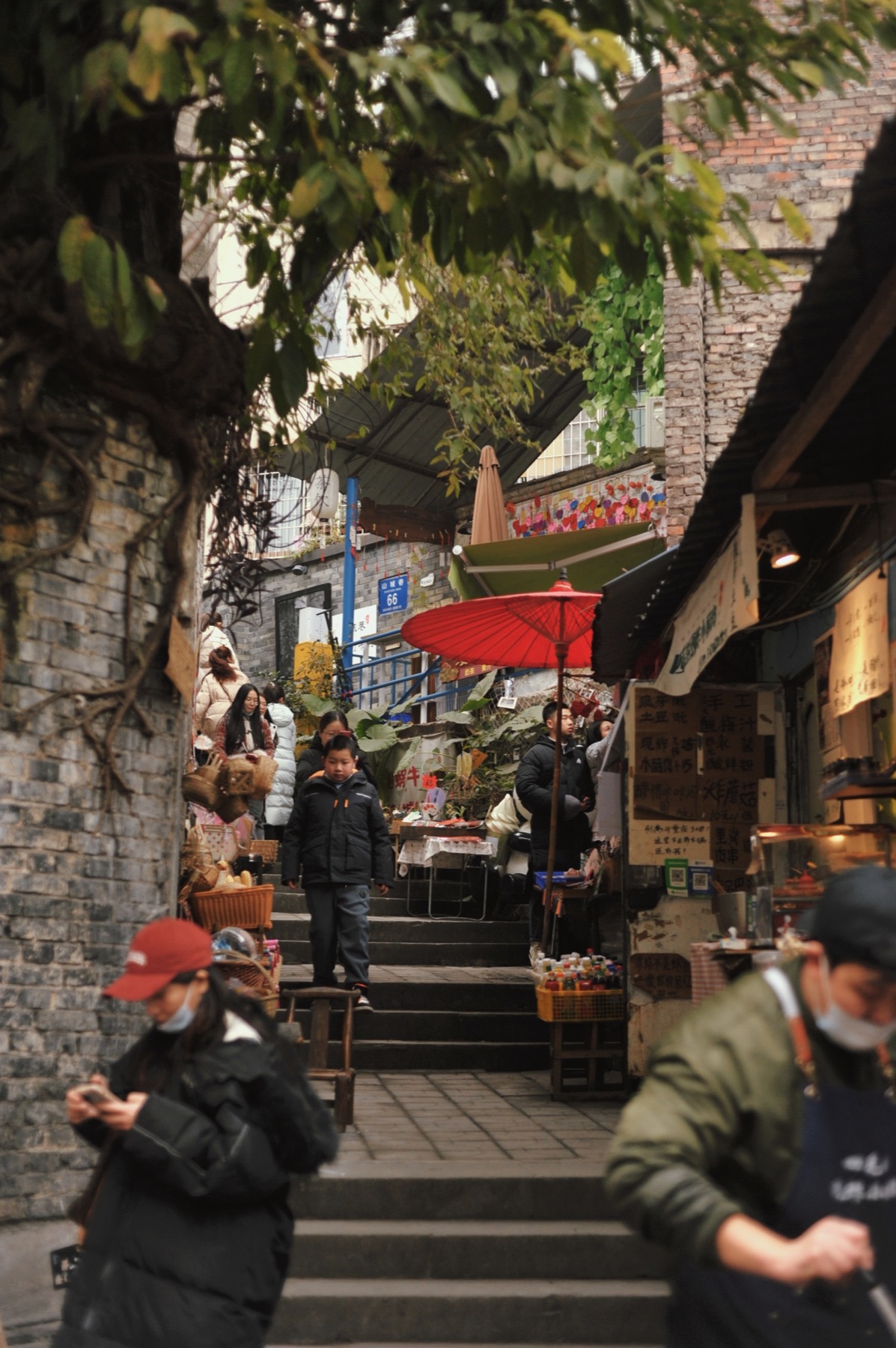 People walking through a neighborhood street in Chongqing